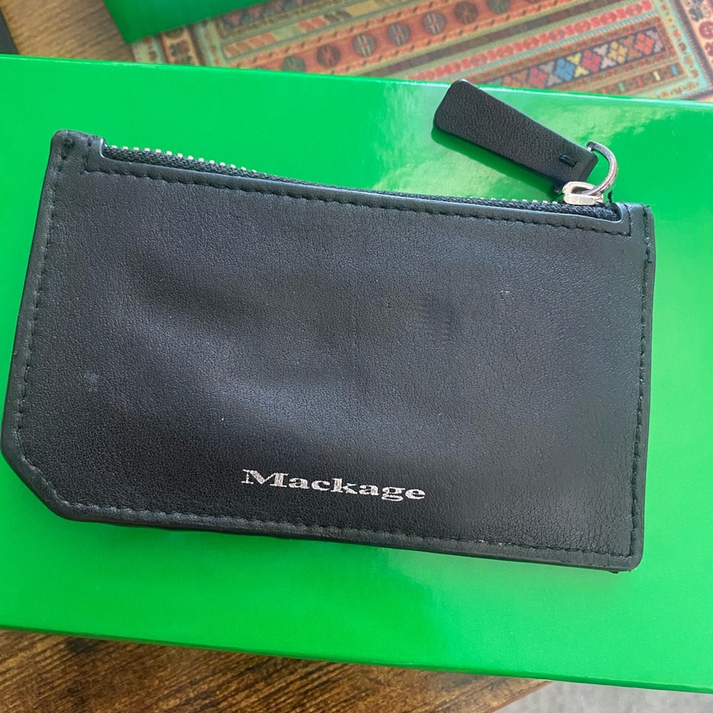 Gently used Mackage card holder with coin pouch.